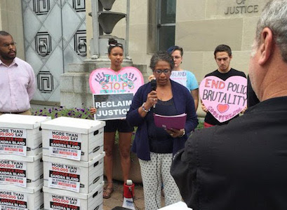 MoveOn members deliver a petition calling for justice for Sandra Bland